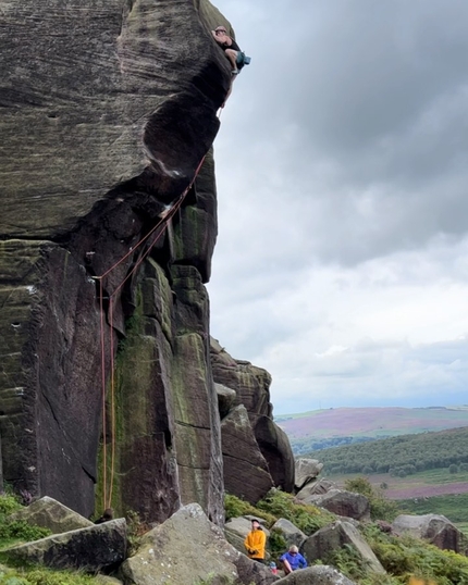James Pearson climbing Parthian Shot in the Peak District at Burbage South, UK