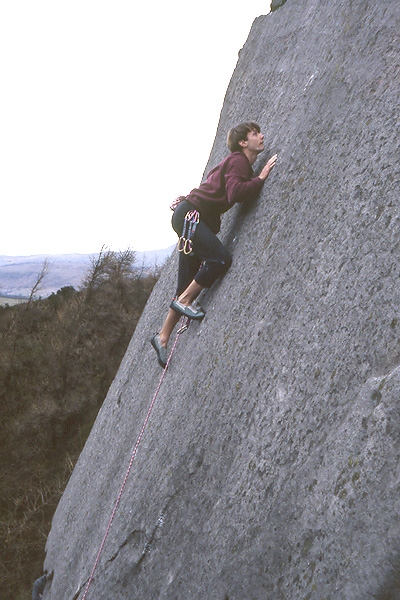 The Roaches, England - Nicholas Hobley edging his way up Wings of Unreason E4 6a, The Roaches, Peak District, UK
