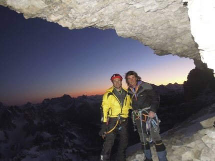 Tre Cime di Lavaredo - Roger Schäli and Simon Gietl and the bivy on the ledge below the summit of Cima Grande, Tre Cime di Lavaredo, Dolomites.