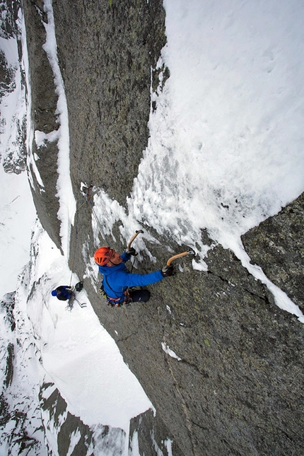 Aiguille du Peigne, Mont Blanc - Jeff Mercier leading pitch 10 of Full Love... for dry and ice (V, 5+,M6 R, 500m): a super thin series of moves takes you to a full arm stretch to decent ice above and a sigh of relief
