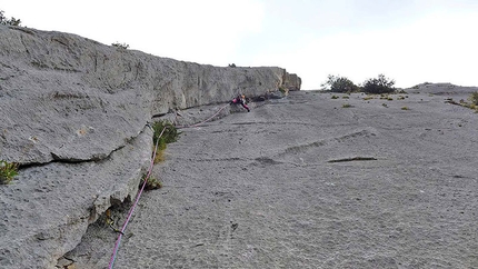 Climbing in Sardinia - Corrado Pibiri climbing the final pitches of Sos de Urtullè.