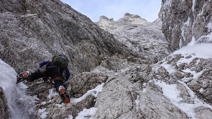 Triglav, Slovenia - Triglav North Face: Matevž Mrak under the base of the route during the winter ascent of the routes Prusik - Szalay and Obraz Sfinge, carried out from 23 - 26 December 2014 together with Matevž Vukotic.