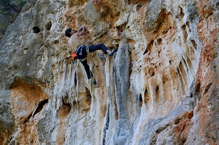 Kyparissi, Greece - Yiannis Torelli climbing Tzambas 7a at the crag Kastraki at Kyparissi, Greece