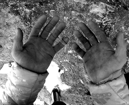 Fabian Buhl, Wetterbockwand - Fabian Buhl's hands on the summit, after having made the winter ascent of Wetterbock (8c, 10 pitches) up the Wetterbockwand, Göll East Face, Berchtesgaden Alps, Austria.