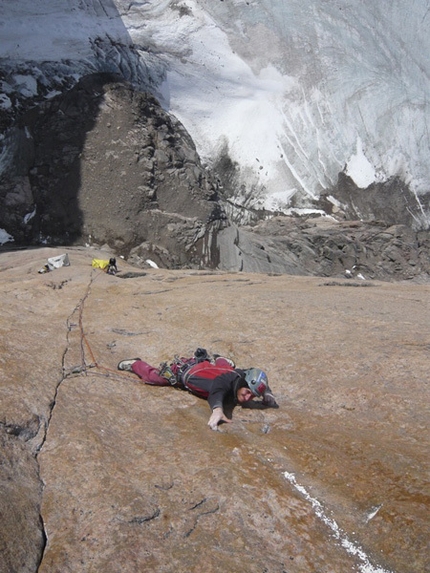Baffin Island - Oliver Favresse crimping hard trying to redpoint pitch 6 of the Belgarian.