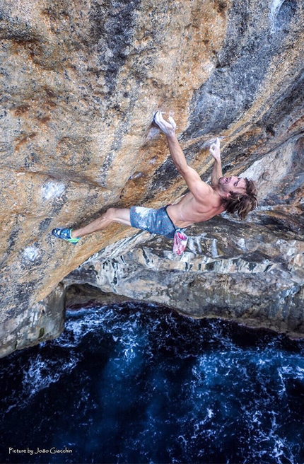 Chris Sharma, Deep Water Solo, climbing, Mallorca - 20 meters above the crashing waves Chris Sharma enters the crux section of his Deep Water Solo testpiece 'Big Fish' 8c+/9a at Soller, Mallorca