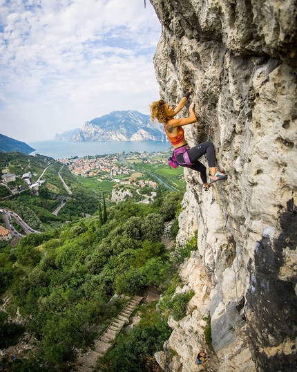 Arco Belvedere - Sara Grippo climbing at the Belvedere crag above Arco, with Lake Garda in the background