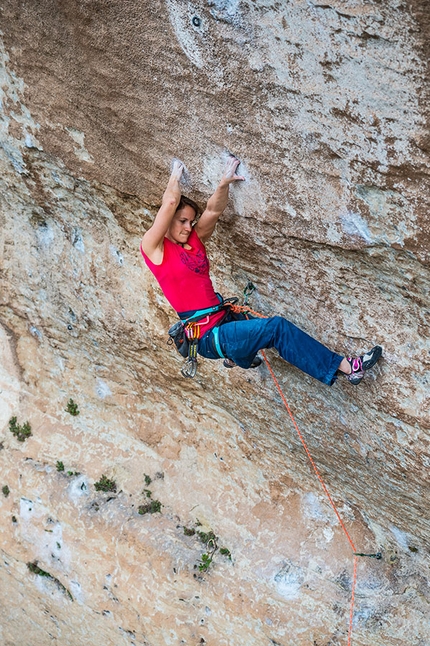 Anna Stöhr, La Rose et le Vampire, Buoux - Anna Stöhr climbing the famous crux cross through on La Rose et le Vampire 8b at Buoux, France. The long reach through caught people’s imagination and has come to be known as the Rose move.