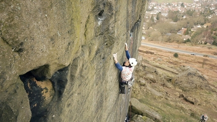 Jacob Cook climbing The Lizard King, gritstone E9 at Ilkley in England
