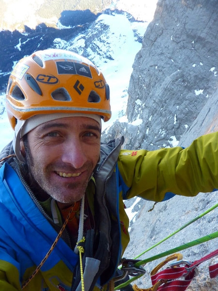 Fabio Valseschini, first winter solo of the NW Face of Civetta - Fabio Valseschini jumaring up through the overhangs on Via dei 5 di Valmadrera, Civetta, Dolomites