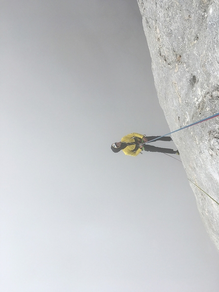 Marmolada, Dolomites, Hansjörg Auer, Much Mayr, Ultimo Tango - Hansjörg Auer observing the wall during the first ascent of Ultimo Tango on Marmolada, Dolomites, 29/08/2018