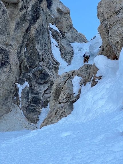 Moose's Tooth, Alaska,  Benjamin Lieber - Benjamin Lieber climbing one of the WI4 pitches about halfway up Ham & Eggs Couloir on Moose's Tooth in Alaska