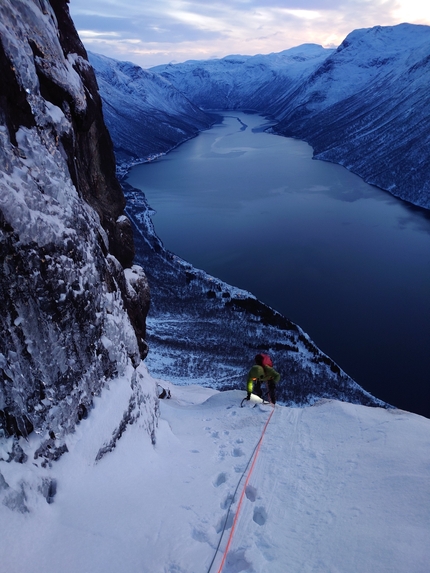 Rånkeipen, Narvik, Norway, Juho Knuuttila, Alexander Nordvall - Juho Knuuttila reaching a ledge during the first ascent of Arctic Circus with Alexander Nordvall on the SW Face of Rånkeipen in Norway