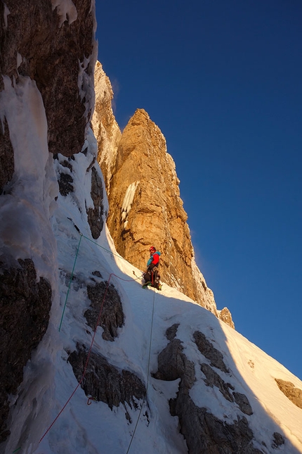 CRAM - Circolo Ricreativo Aziendale Mountime Cima Brenta - CRAM - Circolo Ricreativo Aziendale Mountime: Cima Brenta: Matteo Faletti setting off after the bivy as dawn breaks on pitch 8. 