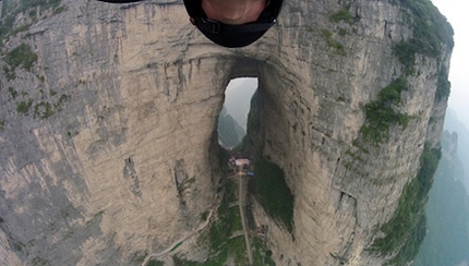 Jeb Corliss flies through Tianmen Cave in China