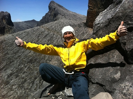 Borneo - Yuji Hirayama celebrating after having freed has the 100m multi-pitch Pogulian Do Koduduo 9a, Mount Kinabalu, Borneo