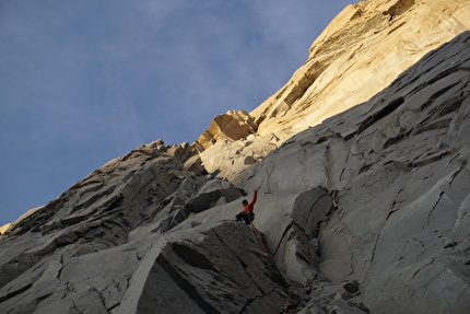 La Espada, Torres del Paine, Patagonia, Sebastian Pelletti, Hernan Rodriguez - Sebastian Pelletti on pitch 8, after leaving the bivy, climbing towards the sunrise while making the first ascent of 'Arma de doble filo' on La Espada, Torres del Paine, Patagonia (Sebastian Pelletti, Hernan Rodriguez 24-25/02/2024)