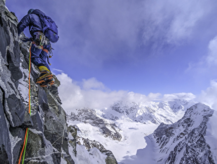Mantok 1 Alaska, Fred Caloggero, Joseph Hobby - Joseph Hobby climbs a rock step on the 'Small Talk Couloir' of Mantok 1 in Alaska.