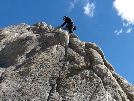 Khane Valley - Nikolay Petkov climbing the last few meters to reach the summit of Grey Tower.