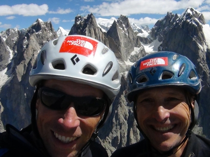 Khane Valley - Doychin Boyanov and Nikolay Petkov on the summit of Grey Tower, clearly visible in the background the peaks Levski, Rila Tangra, Trident, Agil.