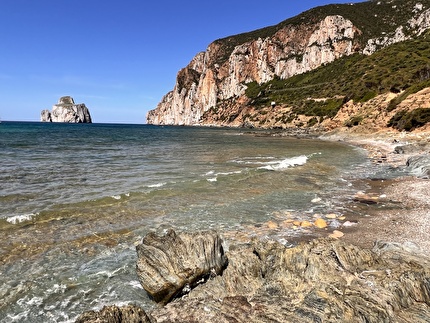 Masua Sardinia - Pan di Zucchero and the Masua sea cliff in Sardinia Masua Sardinia - Pan di Zucchero and the Masua sea cliff in Sardinia