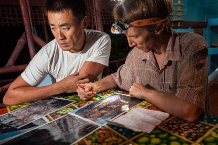 Damai Sentosa, Dragon's Horns, Malaysia - Liu Yong and Arnaud Petit checking rock formations on David’s big prints of the South Tower.