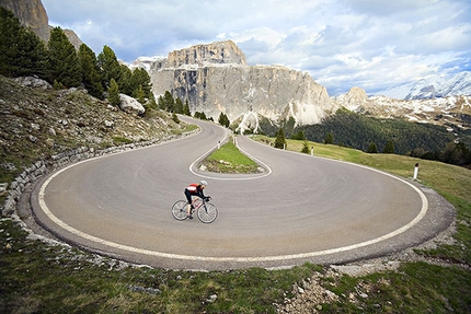 PatitucciPhoto - Amy Rasic riding through the steep, hairpin turns of the Sella Pass above Canazei, Italy