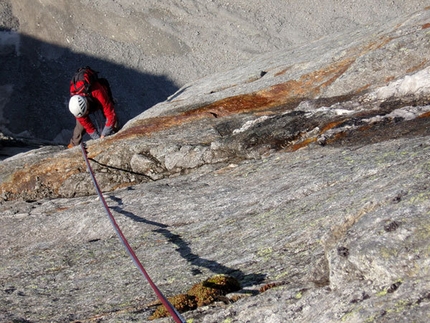 Desperation of the Northface - Jorg Verhoeven nearing the top on the crux 7b pitch of Desperation of the Northface, Zillertal Alps, Austria.