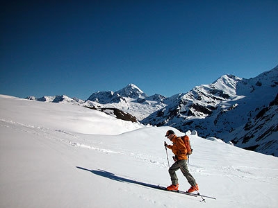 Cevedale: spring ski mountaineering - After having left the Forni glacier the route ascends towards Tresero, with Gran Zebrù in the background