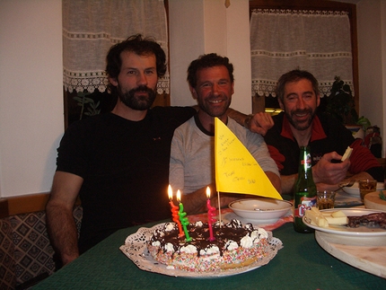 Ilio De Biasio - At Ilio's house after the first winter ascent of Via Flora, Seconda Pala di San Lucano: Cepo Conedera, Toni Zuech and Ilio De Biasio