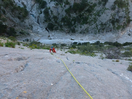 Climbing in Sardinia: Supramonte - Luigi Scema making the first ascent of Schiavi senza Padrone, (VI+/VII-, 370m, Gianluca Piras, Luigi Scema 24-25/10/2013) Punta Cucuttos, West Face, Gola di Gororroppu
