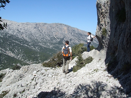 Tiscali, Sardinia - Walkers climbing up to Monte Tiscali enjoying broad views over the Supramonte