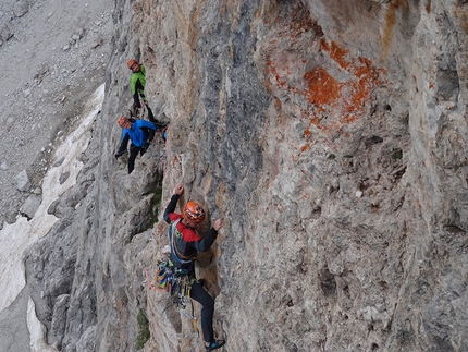 Brenta Dolomites, Brenta Base Camp 2014 - Punta Jolanda: the Baù family (Alessandro Baù, Claudia Mario and Matteo Baù) making the first ascent of Badanti al seguito