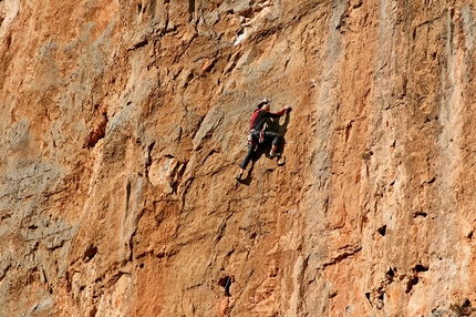 Leonidio, Greece - Aris Theodoropoulos climbing Iannis 6c at the crag Hot Rock, Leonidio, Greece