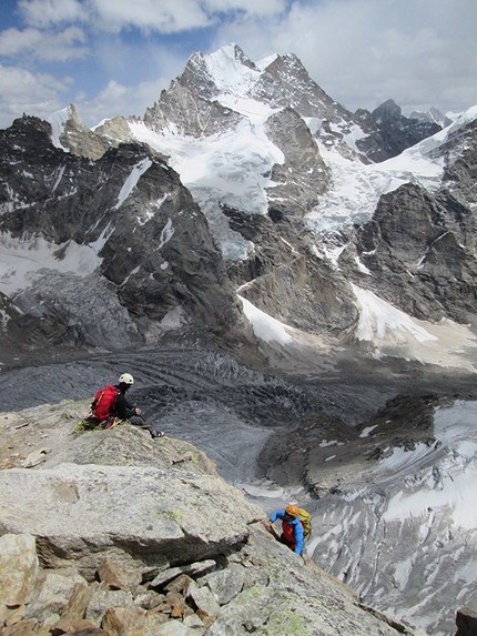 Miyar valley, Himachal Pradesh, India - Elias Gmünder and Cyrill Bösch  topping out onto the summit plateau of Lotus tower.