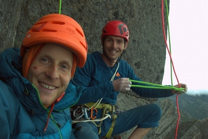 Storpillaren, Vagakallen, Lofoten - Andreas Klarström and Adam Pustelnik, happy during the first ascent first ascent of The Corner kick (8a, 900m) up Storpillaren, North Face of Vågakallen, Lofoten islands, Norway.