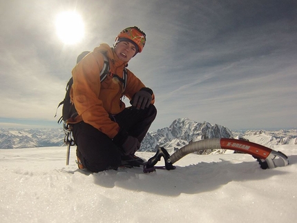 Tom Ballard, Grandes Jorasses, Starlight and Storm - Tom Ballard enjoying the sun on the summit of Grandes Jorasses after having climbed the Colton - Macintyre route in 3 hours and 20 minutes.