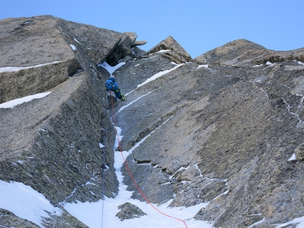 Pyramide du Tacul, Mont Blanc - Matt Helliker eyeing up the steepness above on the crux M7 pitch during the first ascent of Mastabas (M7, 250m), Pyramide du Tacul, Mont Blanc