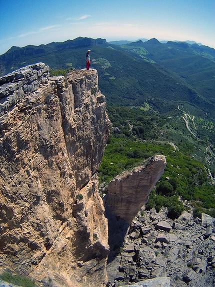 Su Sussiu, Ulassai, Sardinia - Fabio Erriu on the summit of Su Accara,after the first ascent of Incantos,, Ulassai, Sardinia