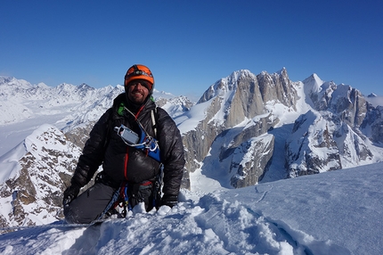 Mt Dickey, Alaska - Mt Dickey, Alaska:  Jason Stuckey elated he is off the face and onto the summit plateau. And after 1.5 days (at his point) without sun it was nice to enjoy a little warmth. The team had spent much of the second day (March 21) attempting to get off the face; after two failed attempts (difficult/dangerous terrain turned us around) we had discussed if we needed to start considering attempting to reverse the route. As this would have been extremely difficult we continued our efforts; fortunately our third attempt was successful.