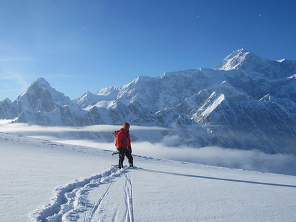 Mt Dickey, Alaska - Mt Dickey, Alaska:  John Frieh leading the descent down from the summit. Behind John on the lookers left is Mount Huntington; almost 4 years ago to the day Jason and John climbed Mt Huntington together making the second winter ascent ever of Mt Huntington. This was Jason and John's first time climbing together. In 2014 Jason and John and a third person made the FWA of Mt Huntington's French Ridge.