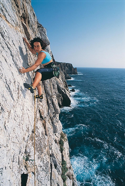 Reequipping with 'marine' material in Sardina by Louis Piguet - Cecilia Marchi climbing Riflessi Magici (one fo the recetnly reequipped sport climbs) at Pranu Sartu, Sardinia.