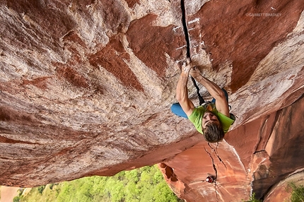 Logan Barber, The Firewall, Liming, China - Logan Barber making the first ascent of The Firewall at Liming. Graded 5.13d/14a, this climb checks in as the hardest trad route in China. Image is Copyright Garrett Bradley. All rights reserved. No use, duplication or adaptation is allowed without written permission