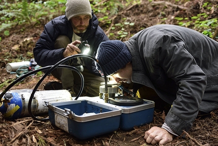 Chris Sharma, Redwood tree, Eureka - Chris Sharma watches research scientist Anthony Ambrose demonstrate a testing process in Eureka, CA, USA on 19 May, 2015.