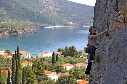 Kyparissi, Greece - Diana Vougesi climbing the route Kastraki 5b+ at the crag Kastraki at Kyparissi, Greece