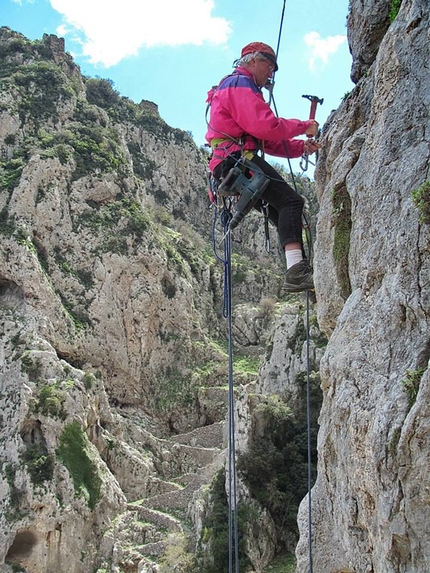 Kyparissi, Greece - Claude Remy in action bolting a new route at Jerome's House, Kyparissi, Greece