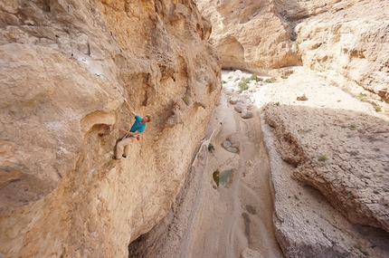 Oman sport climbing Arnaud Petit, Read Macadam, Alex Ruscior - Arnaud Petit climbing at Wadi Bani Khalid, Oman