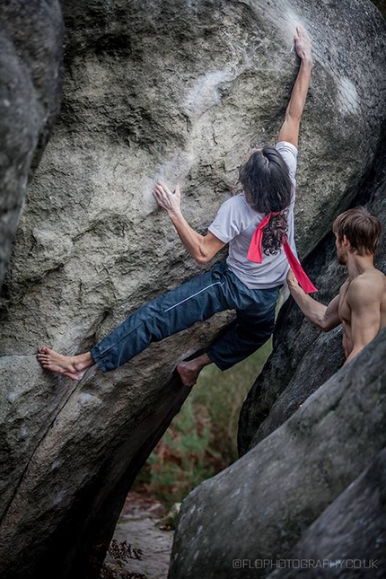 Charles Albert, bouldering, Fontainebleau, France - Charles Albert climbing barefoot on L'alchimist at Fontainebleau in France