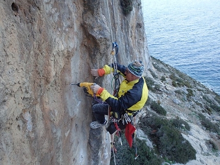 Kalymnos climbing - Claude Idoux rebolting the climbs at Kalymnos, Greece. Here at the Irox sector on Telendos