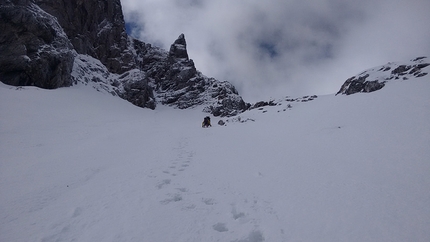 Monte Cogliàns, Carnic Alps, Mirco Grasso, Claudio Betetto, Luca Iacolettig - Moving onto the upper snowfield, during the first ascent of 'Altro che in Scozia' (Claudio Betetto, Mirco Grasso, Luca Iacolettig 15/05/2016) Monte Cogliàns north face, Carnic Alps